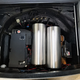 Air suspension tanks neatly tucked into the spare tire well.
